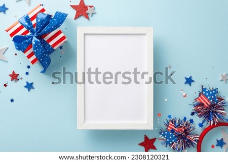 Celebrate Independence Day in style with arrangement of party paraphernalia. Top view glittering stars, sparkling confetti, headband, giftbox on pastel blue setting, blank space for message or picture