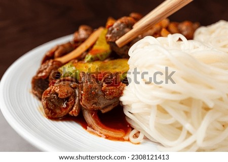 Whelk with somen with spicy sauce and vegetables Royalty-Free Stock Photo #2308121413