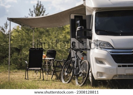 a vacation trip in a motorhome, a rest in a van. Royalty-Free Stock Photo #2308128811