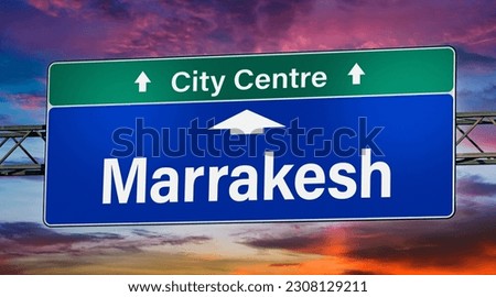 Road sign indicating direction to the city of Marrakesh.