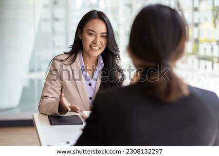 Businesswoman discussing with colleagues in the office, job interview. Royalty-Free Stock Photo #2308132297