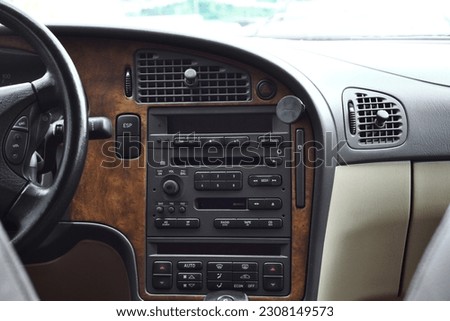 The car's beautiful interior is black and brown in color Royalty-Free Stock Photo #2308149573
