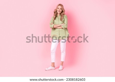 Full length photo of pretty confident lady wear green shirt smiling arms crossed isolated pink color background