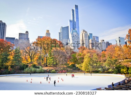 Ice skaters having fun in New York Central Park in fall  Royalty-Free Stock Photo #230818327