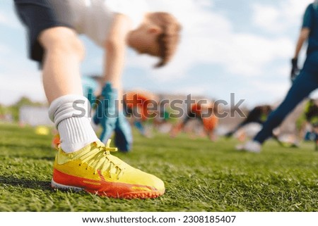 Soccer Football Goalkeeper Warming Up Before the Football Match. Goalie in Stretching Muscleas at Training Unit on Practice Pitch. Soccer Goalie Training Camp Royalty-Free Stock Photo #2308185407