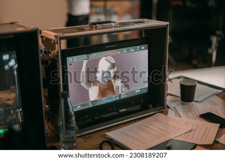 Film set, monitors and modern shooting equipment. Film crew, lighting devices, monitors, playbacks - filming equipment and a team of specialists in filming movies, advertising and TV series Royalty-Free Stock Photo #2308189207
