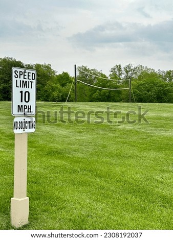 Speed Limit sign with volleyball net in background