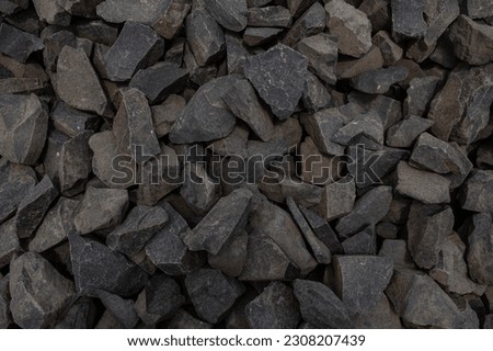Large gravel as a background. Gray granite gravel background. Building stone. Banner design