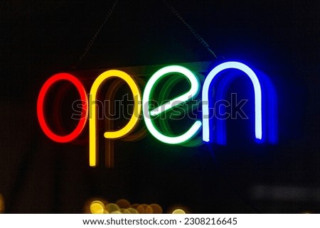 A colorful neon "open" sign.