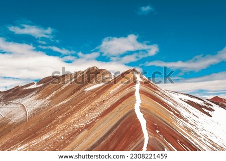 Rainbow mountain with blue sky and snow in Peru Royalty-Free Stock Photo #2308221459