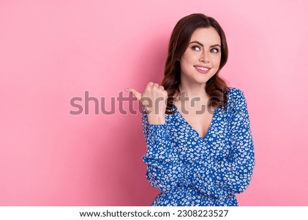Portrait of adorable pretty lady wear blue trendy clothes fingers demonstrate empty space seasonal sale isolated on pink color background