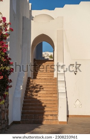 Detail of stairs and white wall of a house on the street of Egypt in Sharm El Sheikh, architecture concept