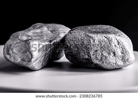 Manganese stones on electronic scale. Metal used in industry. Mineral extraction concept. Royalty-Free Stock Photo #2308236785