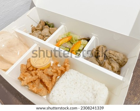 a lunch box rice package ordered online from a Jejamuran restaurant whose basic menu is processed mushrooms