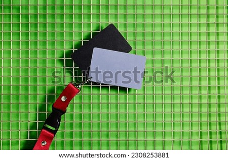 grey card, a photographer’s tool on fence background, determining the correct white balance