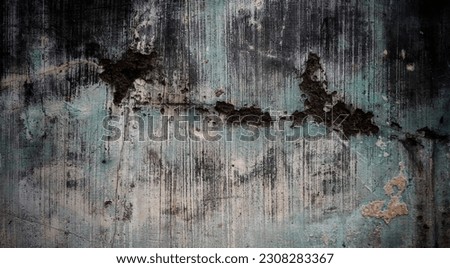 A weathered wooden wall with a full frame of intricate, textured patterns and an aged appearance in the background.