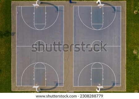 Top down of two basketball courts at the park