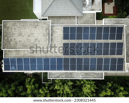 Top view of solar panel installation work on the rooftop of a residential building
