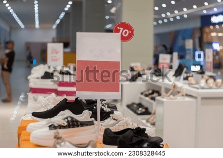 blank red board that can be used for a discount mockup at a sale of women's shoes and sandals Royalty-Free Stock Photo #2308328445