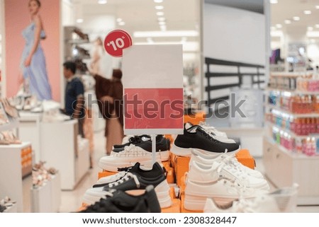 blank red board that can be used for a discount mockup at a sale of women's shoes and sandals Royalty-Free Stock Photo #2308328447