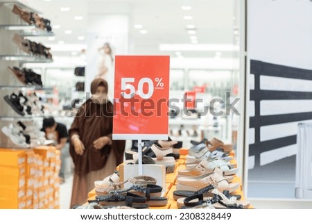 blank red board that can be used for a discount mockup at a sale of women's shoes and sandals Royalty-Free Stock Photo #2308328449
