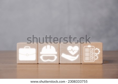 Occupational Safety and Health Administration (OSHA) Industry Concept, Wooden block with OSHA icon on virtual screen.