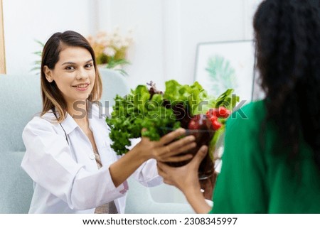 Female woman having a consulting with a professional doctor or nutritionist about eating and nutrition. Doctor explaining to female patient about healthy eating and dieting.