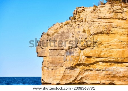 Lake Superior seen with face in rock at National Park Pictured Rocks in Michigan