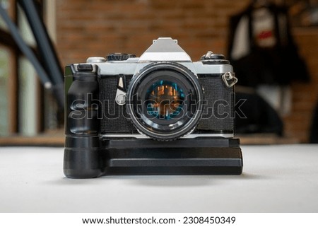 Retro film photo camera on white
