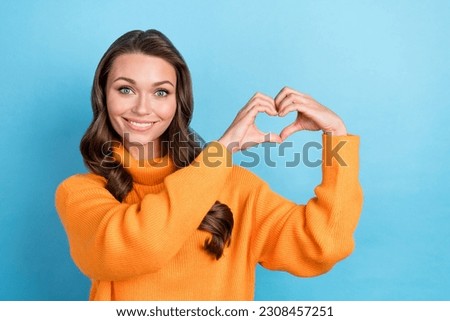 Portrait attractive lady showing heart sign hands ask people donate for Ukraine wear pullover isolated blue color background
