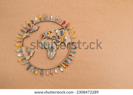 World Population Day, creative concept. Large and diverse group of people in the shape of the world map Royalty-Free Stock Photo #2308472289