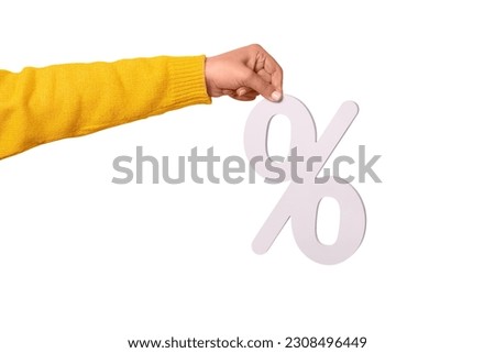 Woman hand holding 3D  white percentage sign isolated on white background