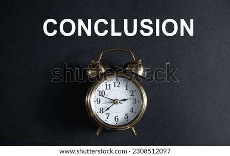Alarm clock with a Conclusion word on the black background.