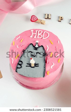 Trendy bento cake pink color with cute decor on light background. Cake for Birthday , Bento Cake for Two. fashionable dessert. Home baking idea for holidays. small business