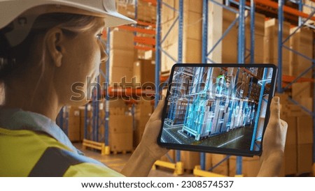 Futuristic Technology Warehouse: Female Worker Doing Inventory, Using Augmented Reality Application On Tablet. Woman Analyzes Digitalized Products Delivery Infographics in Distribution Center. Royalty-Free Stock Photo #2308574537