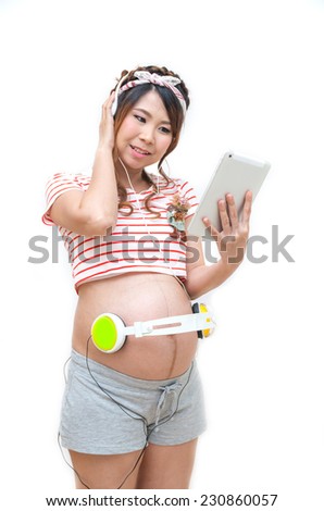 Pregnant woman listening the song