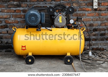new electric air compressor, air filler complete with air pressure gauge Royalty-Free Stock Photo #2308607647