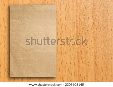 Blank gray paper catalog, Magazines book paper gray mock up on wooden background, Trifold brown template paper on brown wood texture for design, Paper with wood texture still life style