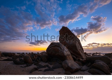 Sunrise the sea, rocks shaped like penguins