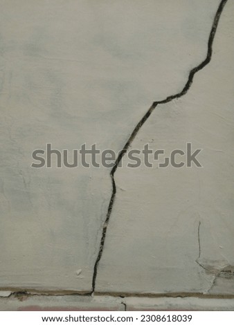 a crack in the wall that had begun to crumble