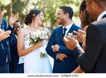 Wedding ceremony, couple and people clapping hands in celebration of love, romance and union. Happy, smile and bride with bouquet and groom walking by guests cheering for marriage at an outdoor event Royalty-Free Stock Photo #2308651391
