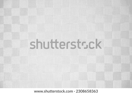 Checkered background with shades of gray.