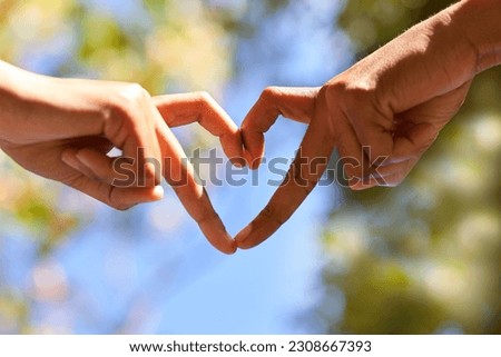 Two women make heart shape with their hands, fingers - Earth Day, love nature