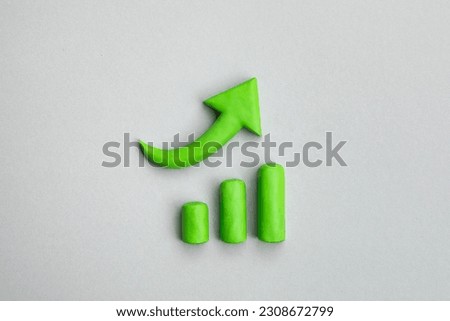 Business growth concept, 3d green arrow pointing up and chart indicating development. Three dimensional simple signs. Financial prosperity, business plan concept.