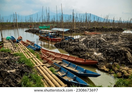 View of fishing boats on the shores of Lake Rawa Pening.