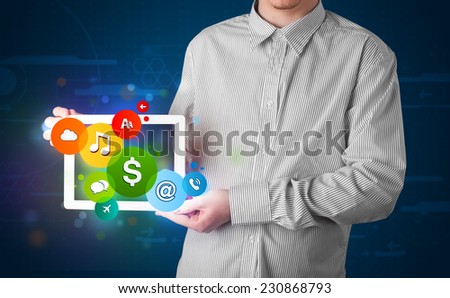 Young businessman presenting colorful modern signs