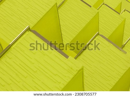 Abstract Architecture Background. Vibrant light lime green geometric structure modern building construction. exterior walls balconies fragments close up detail. Geometrical pattern. minimal concept