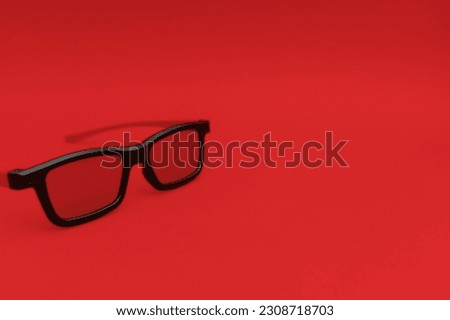 Movie sunglasses on a red background