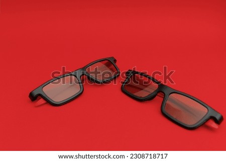 Movie sunglasses on a red background