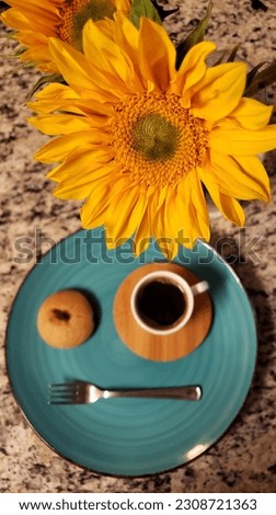 Yellow sunflower and morning espresso with cookie